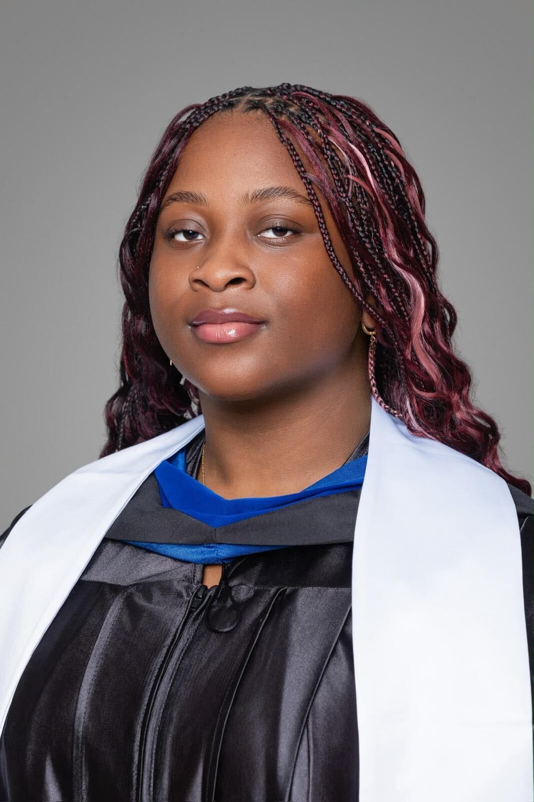 Portrait of Jalicia Thoms, Skills for Success scholarship recipient, in graduation attire.